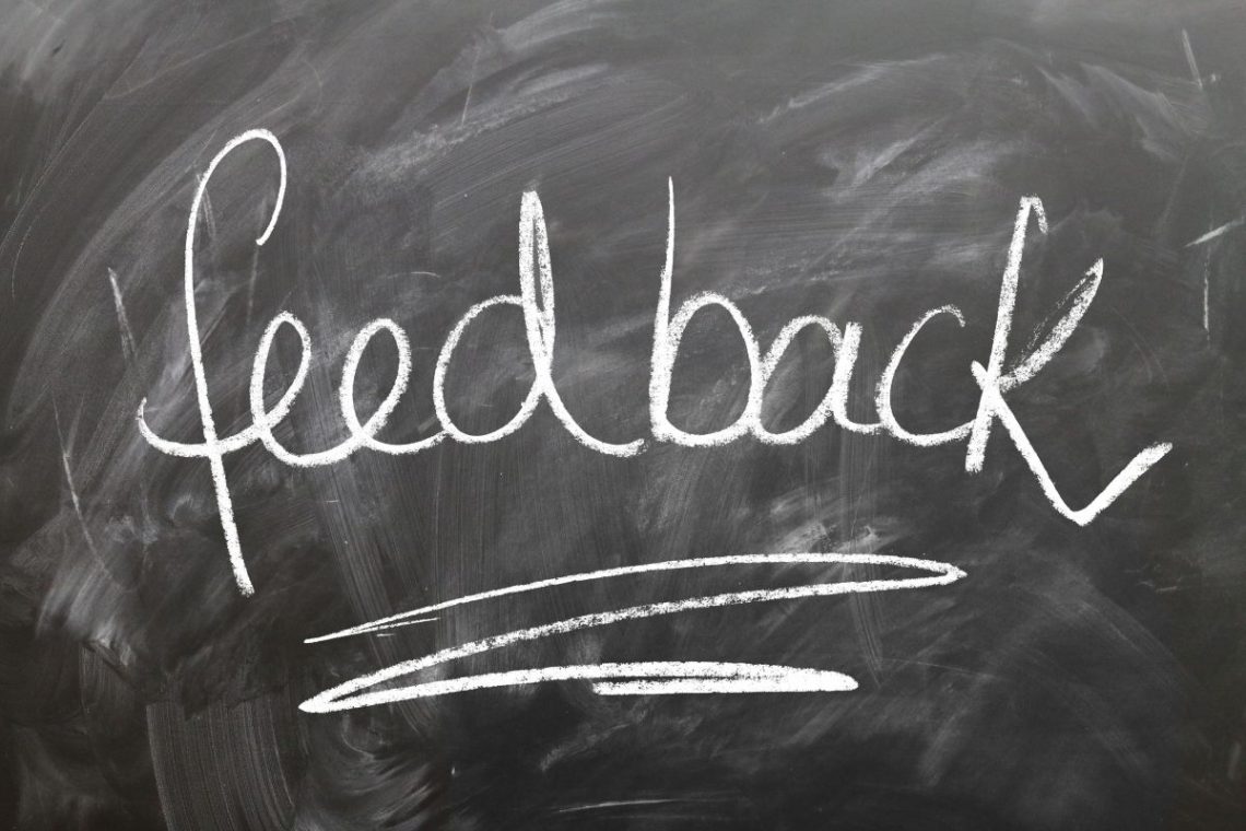Dentist using patient feedback as written on this chalk board