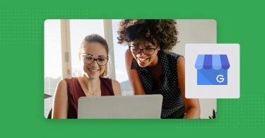 Two women looking at a laptop screen.
