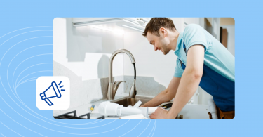 A plumber working on a kitchen sink