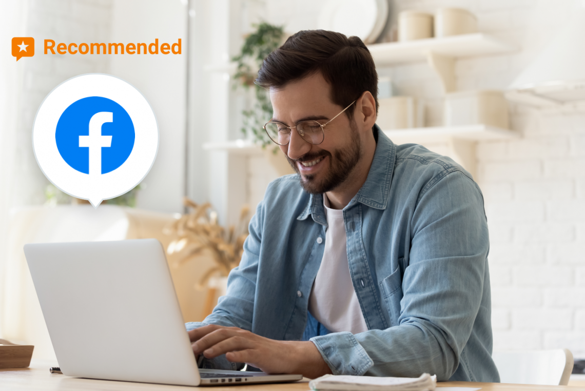Image of a man on his laptop with a facebook logo over it.