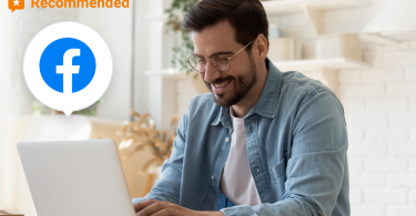 Image of a man on his laptop with a facebook logo over it.