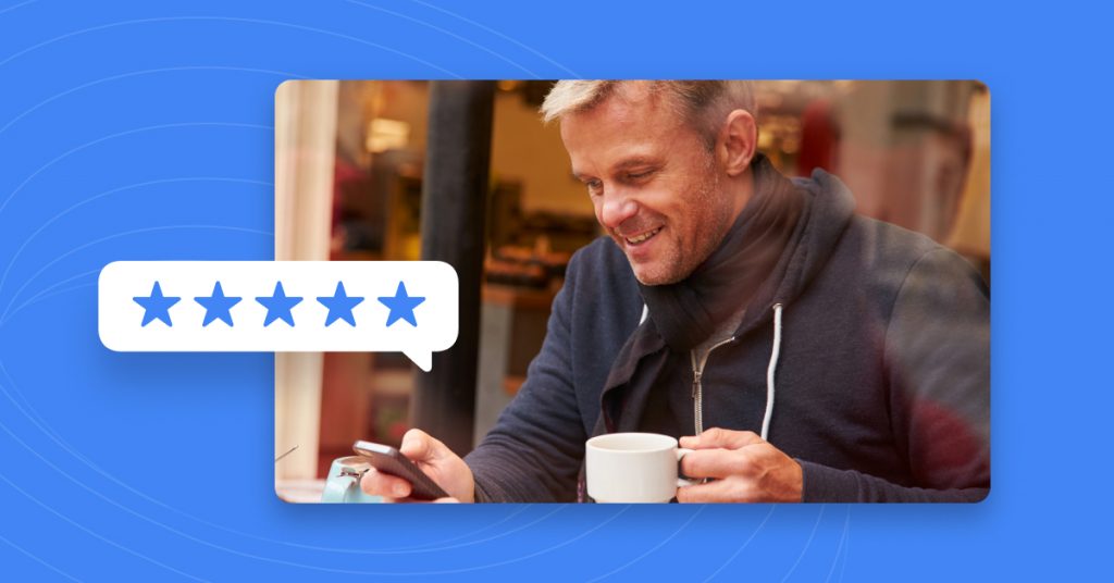 Man using smartphone holding coffee looking at business review sites