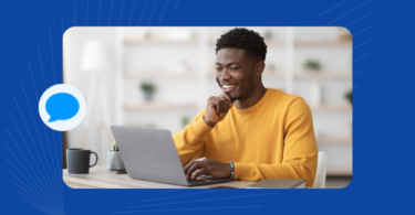 A smiling person getting customer support via a customer service chatbot.