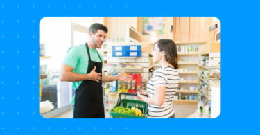 Store clerk speaking with a loyal customer about their referral program.
