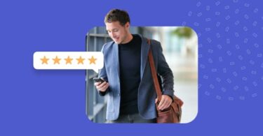 A delighted online reputation manager looking over the company's customer reviews on their mobile device.
