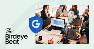 A group of people using laptops with a Google logo on a shield representing ads safety.