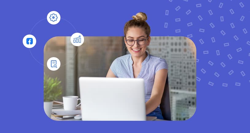 A smiling online reputation manager hard at work on their laptop.
