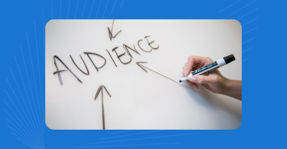 Someone writing the word 'Audience' on a whiteboard.