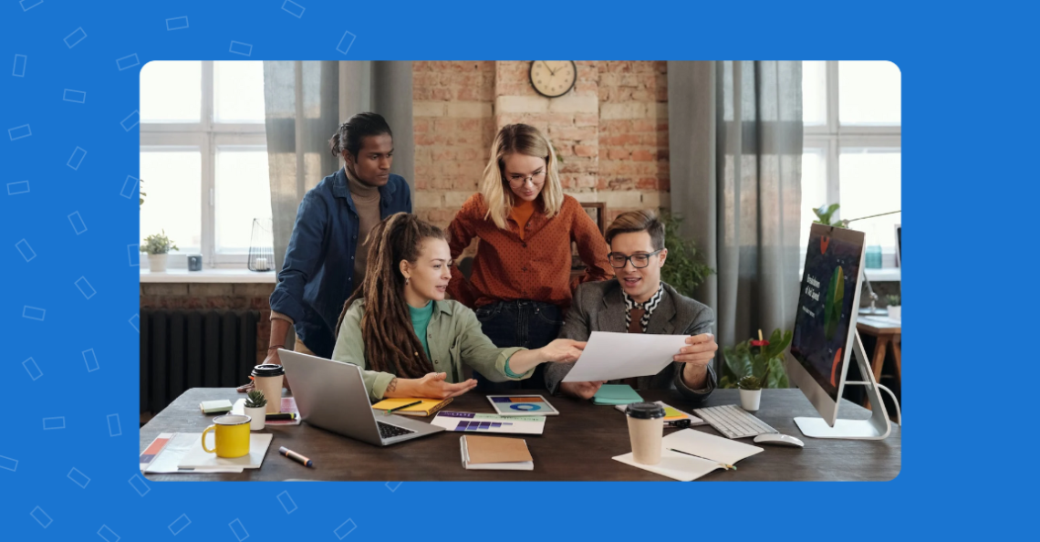 Image depicts a group of people consulting for a business project.