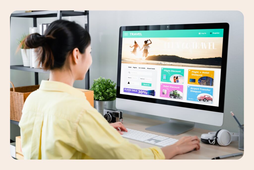 This image shows a woman using a desktop computer, working on her own website