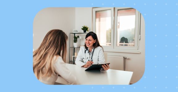 Image showing a happy patient talking to her doctor