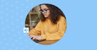 Image shows a person working on their laptop for social media